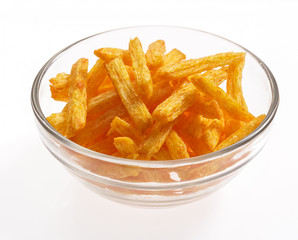 Snacks in a glass dish on a white background.