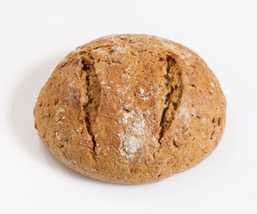 Round rye bread on a white background.