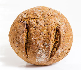 Rye round bread on white background.