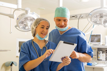 Doctor and nurse using tablet computer