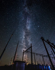 Milky way and starry sky over the power line.