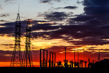 Bright sunset. Power lines in the foreground.