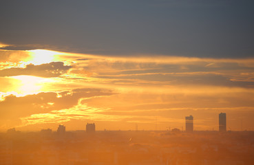 Fototapeta premium Sunset and clouds background in the evening, city downtown with sunset sky