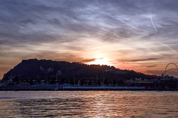 Montjuic Mountain serene sight at Sunset. Beautiful view from Port Vell Barcelona, Spain