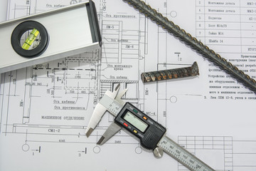 Man holding blueprints at construction site