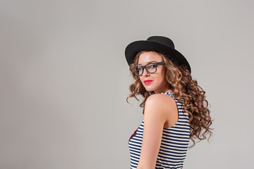girl in glasses and hat