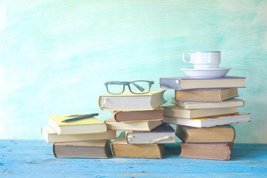 vintage books with coffee cup and specs, free copy space