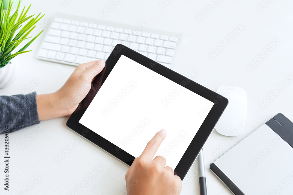 Aufkleber hand using digital tablet finger touch blank screen on desk work