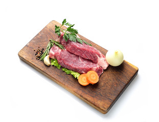 raw steak on a cutting board