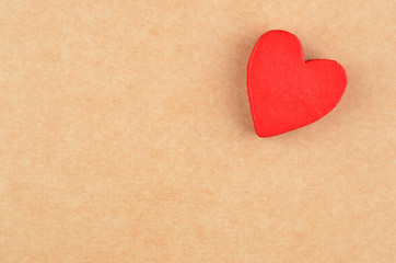 Heart on cardboard background
