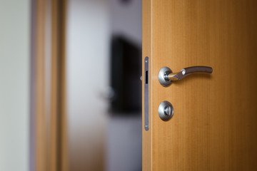 Hotel room or apartment doorway with open door