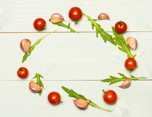 arugula leaves, garlic and tomatoes