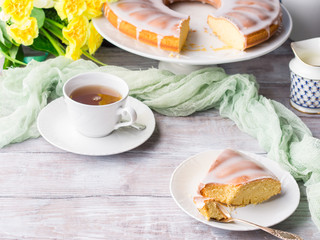 Bundt cake with sugar frosting. Spring breakfast set. Easter festive treat