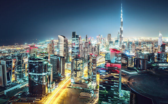 Amazing nightime skyline: skyscrapers of a big modern city. Downtown, Dubai, United Arab Emirates. Colorful cityscape.