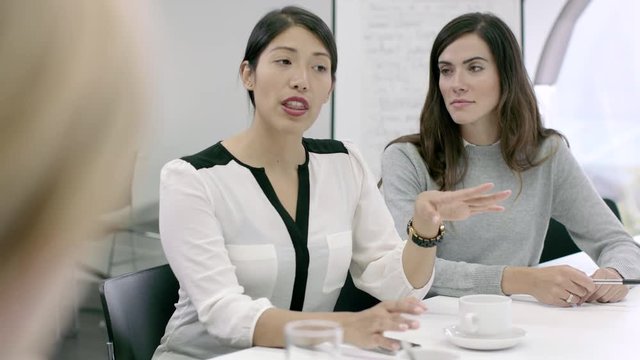 Women Working Together in meeting room