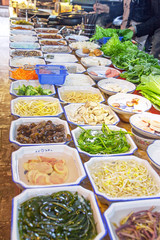 Variety of Chinese dishes at the market, Chinese street food concept.
