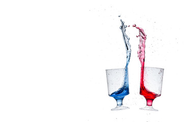 Red And Blue Water Splash In Glasses 