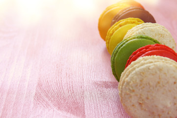 colorful macaron on pink background.