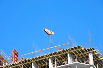 Crane and highrise construction site