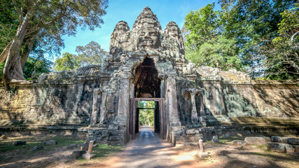 Siem Reap, Cambodia, December 06, 2015: The Bayon gate of Angkor Thom the ancient Khmer empire in Siem Reap, Cambodia.