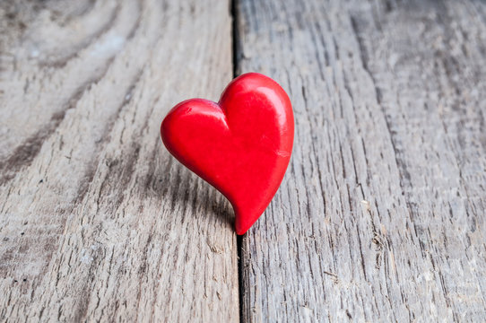 Heart on grunge wooden background. Valentines day card
