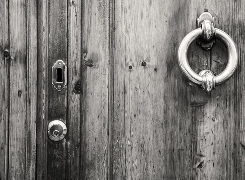 Details of an old wooden door in Florence,Tuscany, Italy (black and white).