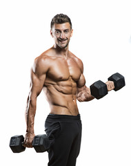 mature athlete posing  with dumbells, dramatic lighting on white  background  