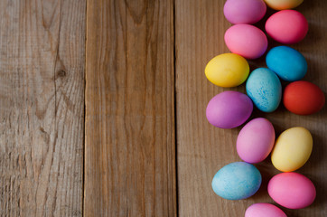 Easter eggs on brown wooden background