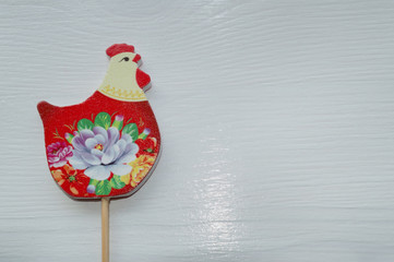 wooden chicken with flowers art