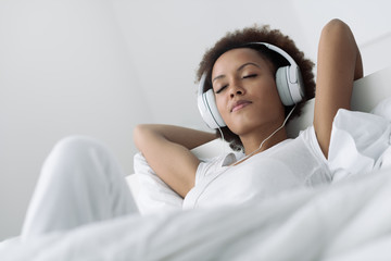 Woman relaxing and listening to music