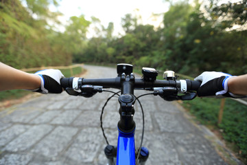 Fototapeta na wymiar riding mountain bike on forest trail