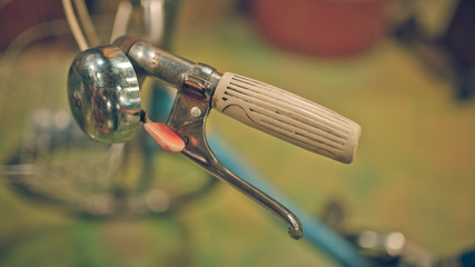 Old rusty a bicycle handlebars and ring bell. (vintage style)