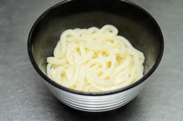 Japan hot udon noodle in bowl wait hot soup with dried fish