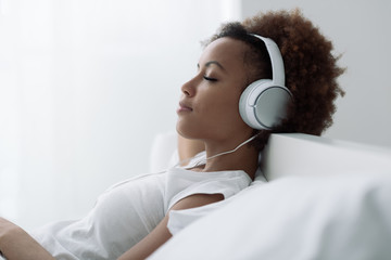 Woman relaxing and listening to music