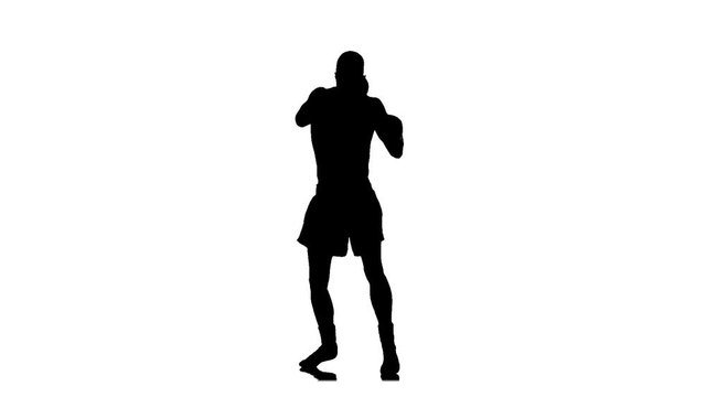 Shadow boxing. Silhouette in slow motion