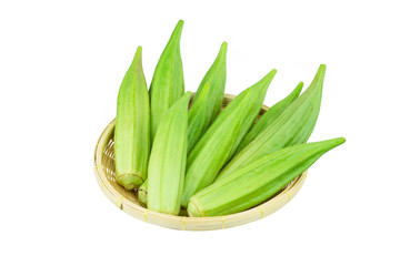 Fresh young okra in .Bamboo Basket isolated on white background