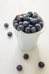 Fresh blueberries in white mini bucket