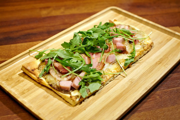 Focaccia with jamon, peper cream and cheese.