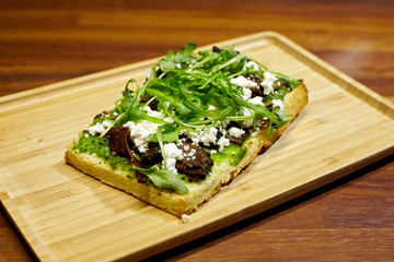 Bruschetta with handmade pastrami and cheese.