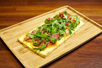 Focaccia with jamon, peper cream and cheese.