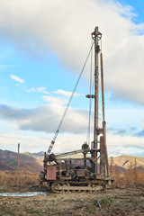Fototapeta na wymiar Drilling rig in field