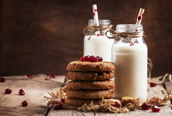 Drinking yogurt in bottles and cookies, selective focus