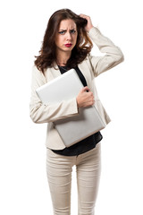 Frustrated pretty young business woman with laptop
