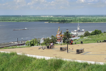 Fototapeta premium View on the Volga river, river station and the Stroganov Church. Nizhny Novgorod, Russia