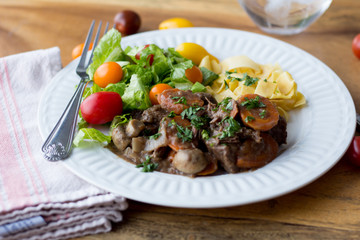 Beef ragout on a white plate 