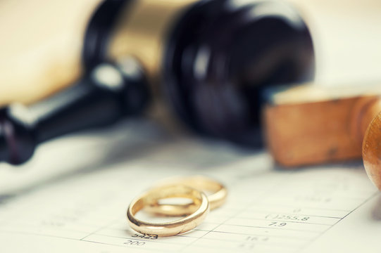 Wedding Rings And Wooden Gavel