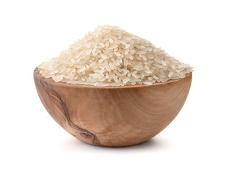  Uncooked dry rice in wooden bowl