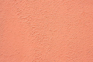 orange plaster wall texture useful as background