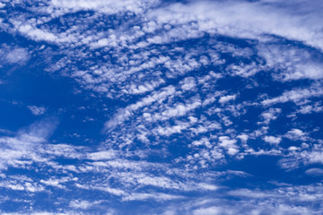 Naklejka na ściany i meble Blue summer sky with light white clouds. Background 01.