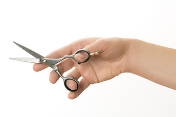 hairdresser holding in hand scissors for cutting hair isolated on white background